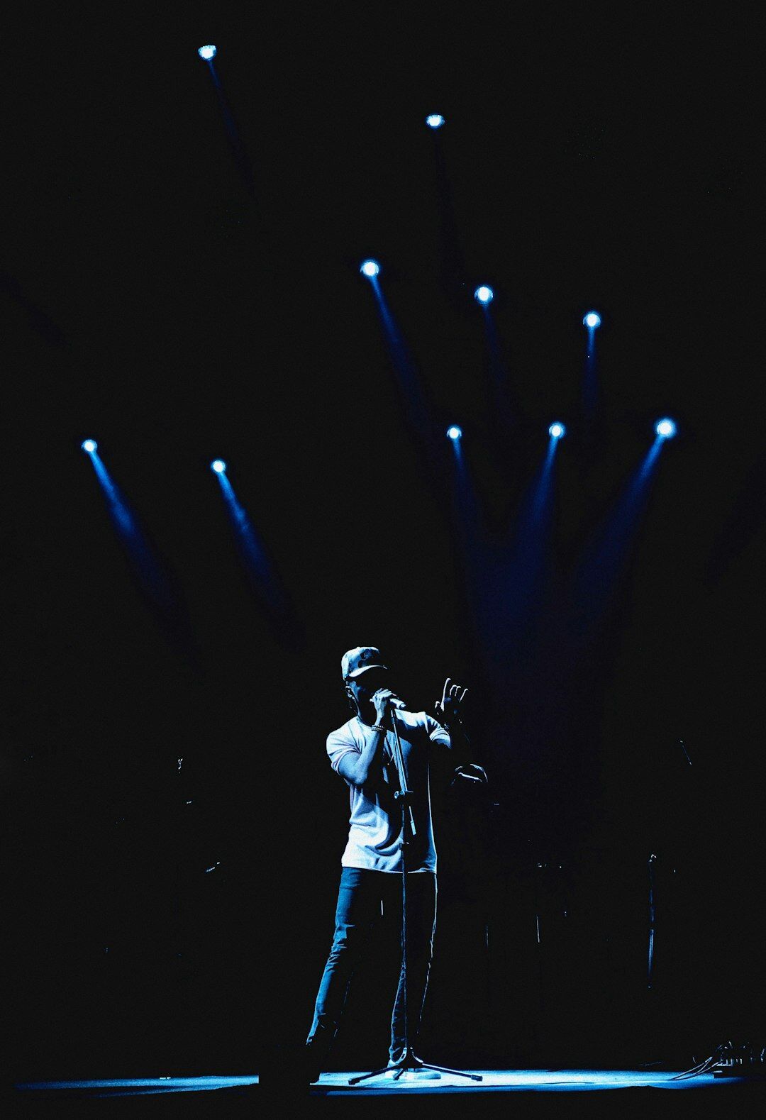 Uruguayan pop singer performing on stage with a microphone